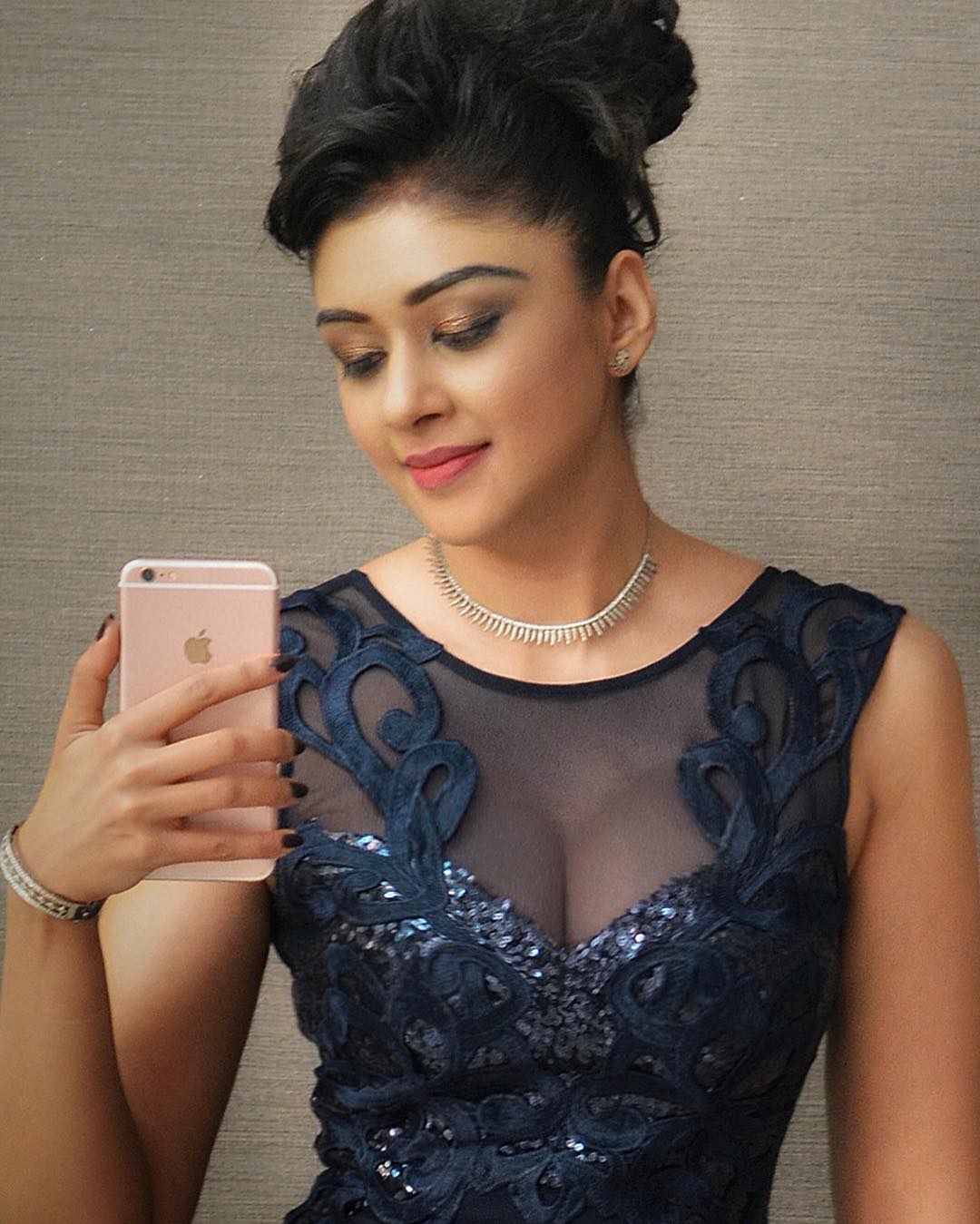 Sapna Vyas Patel in a gown
