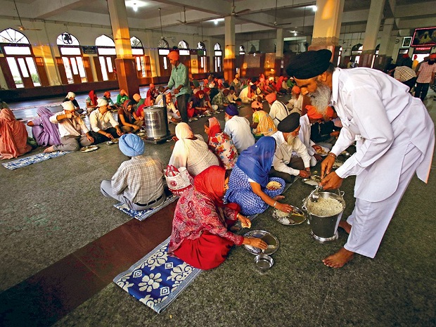 Serving people in Golden Temple langar - Langar dining hall