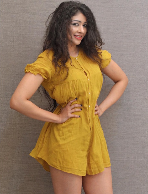 Sapna Vyas Patel in a dress