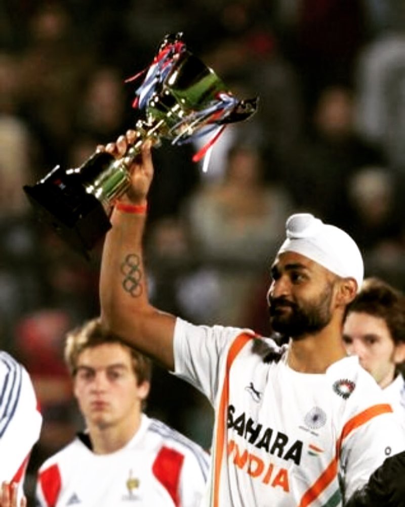 Cup holding Sandeep Singh