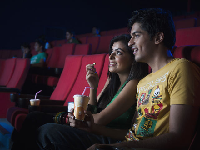 Couples inside cinema hall