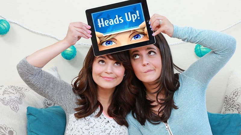 girls playing Heads Up game