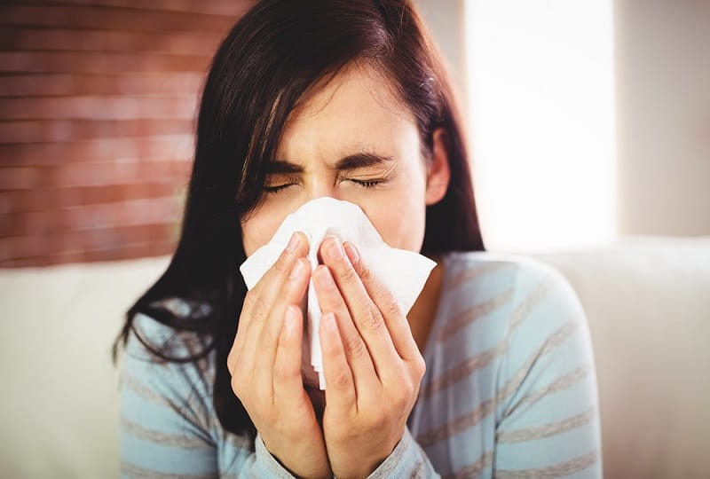 Girl sneezing