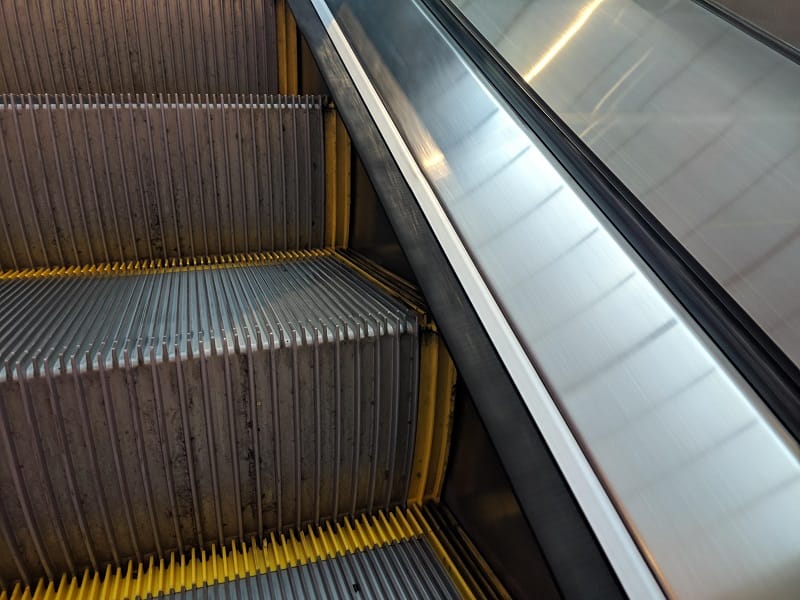 Reason for brushes on the sides of escalators