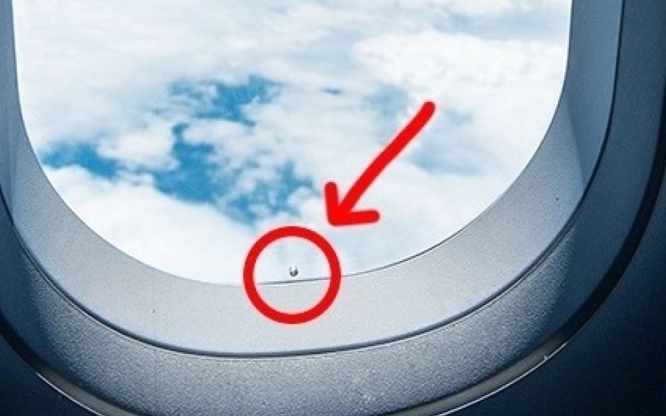 Why does the airplane window have a hole
