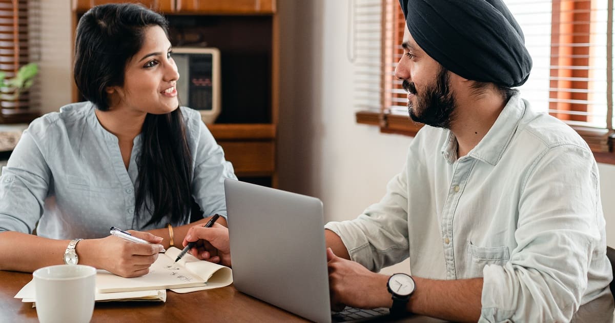 Happy Indian couple talking