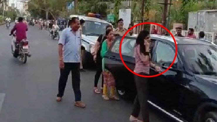 Ravindra-Jadejas-wife-Reeva-Solanki-outside-her-BMW-X1-after-the-alleged-assault