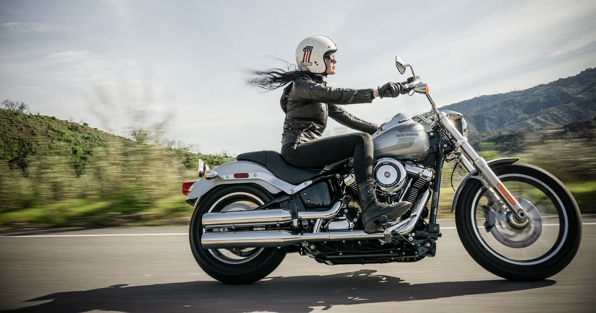 Woman riding harley-davidson