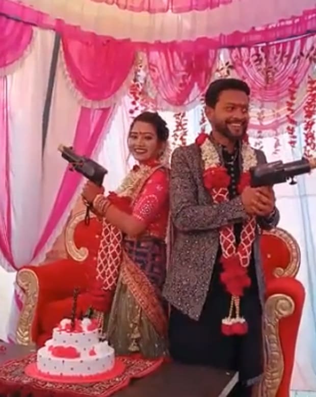 Bride-Groom-Fire-Gun-Crackers-At-Wedding