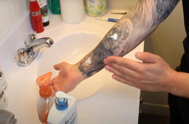 Apply ointment or moisturizer on tattoo- tattoo aftercare tips