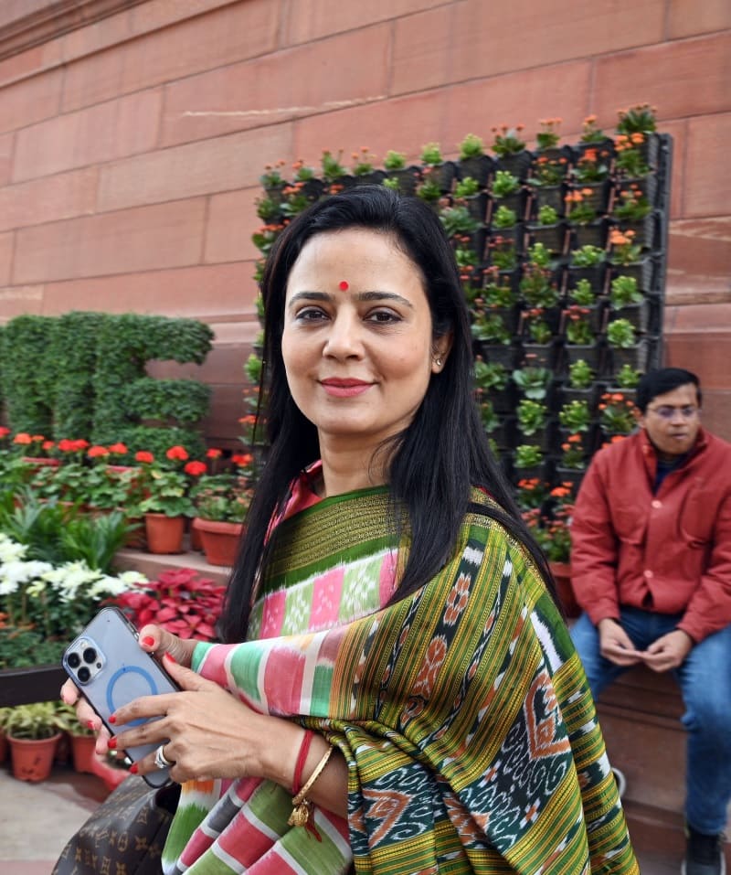 Moitra responds as pics of her raising a toast with Tharoor, posing with  cigar surface