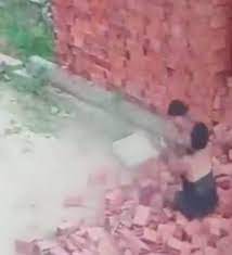 Mother Saving Her Child From Falling Bricks