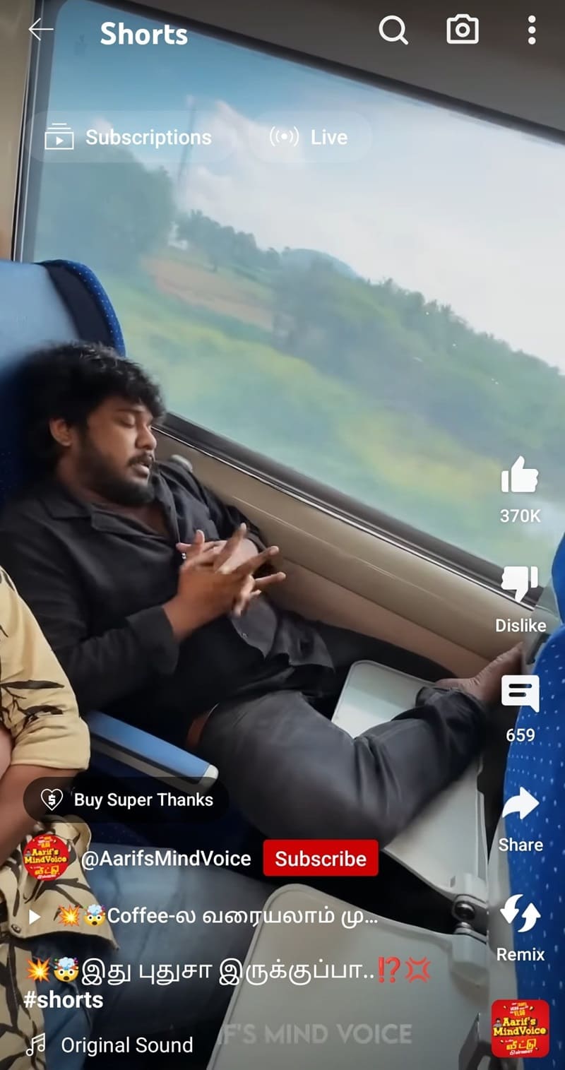 man with feet on food table in train