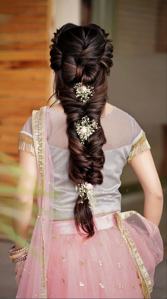 Braided reception Indian bridal hairstyle