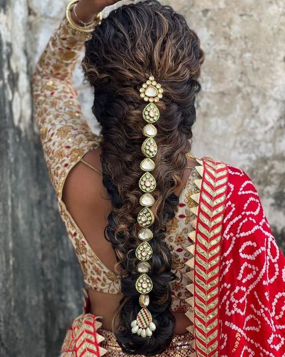 Messy reception Indian bridal hairstyle