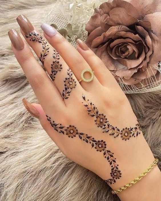 back hand flower mehndi design