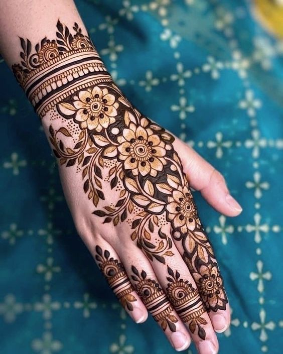 back hand flower mehndi design