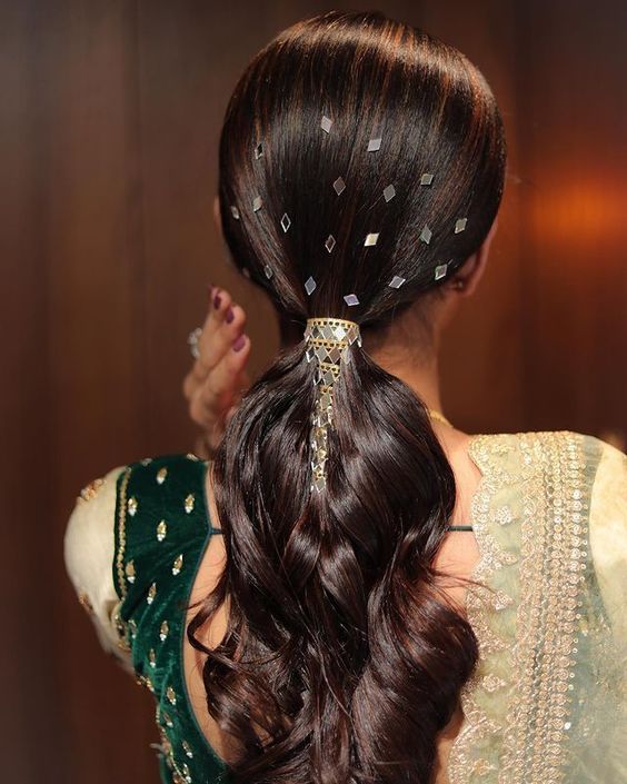 Low ponytail adorned with shiny stones