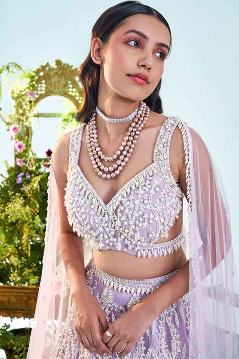 Pearl-embellished-sleeveless-stylish-fancy-net-blouse-design