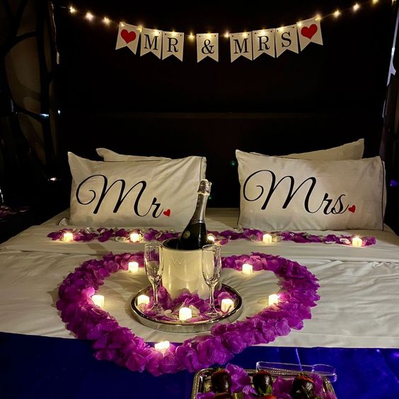Purple heart decor on bed