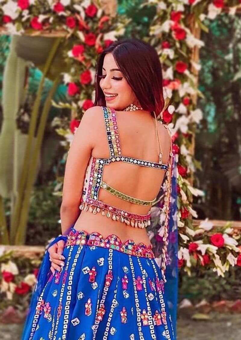 Strappy-back-embellished-with-mirrors and-cowrie-shells-modern-lehenga-blouse-back-design