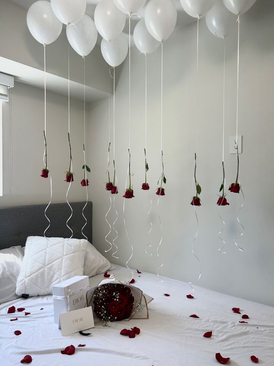 White balloon decor with roses