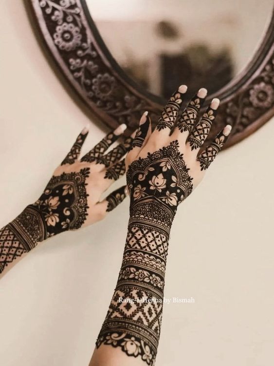 Arabian back full hand bridal mehndi design with lotus motifs