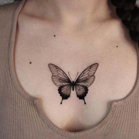 Butterfly chest tattoo for women