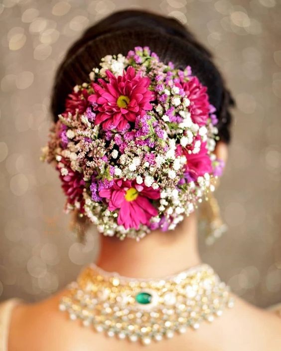 Colourful floral bun hairdo
