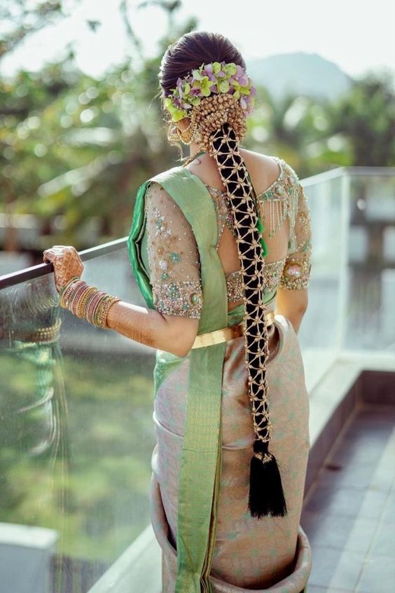 Embellished long braided hairstyle for saree