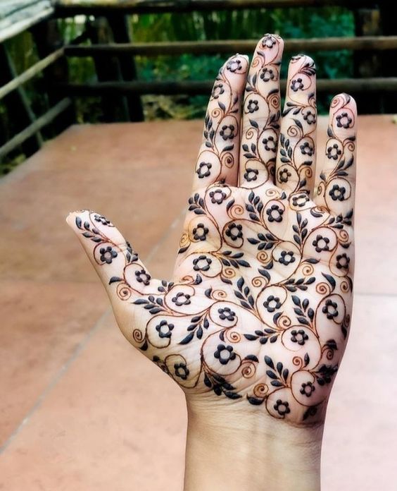 Front hand floral mehndi design simple