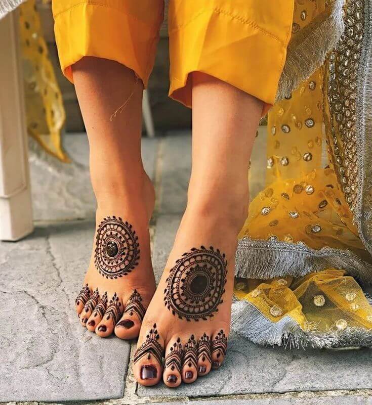 Mandala henna design on feet