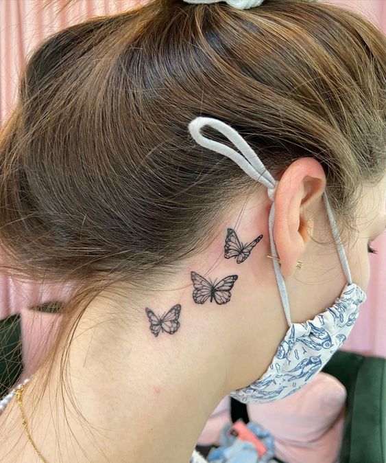Neck tattoo idea with butterflies