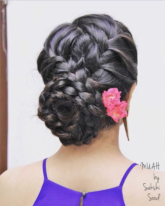 Party bun hairstyle for saree with twisted braid