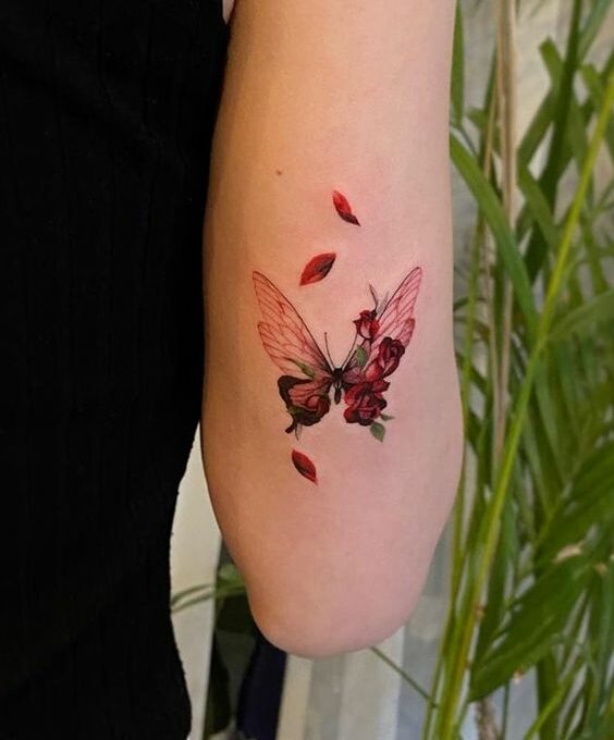 Red butterfly with roses tattoo idea