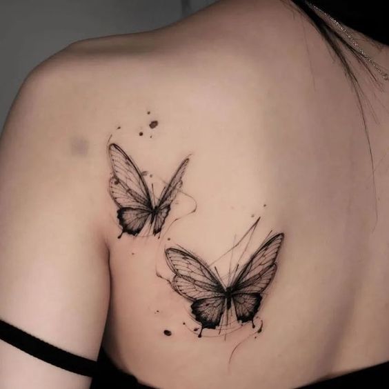 Simple butterfly shoulder tattoo