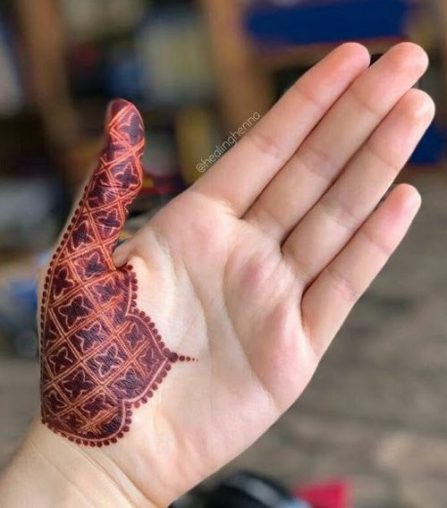Thumb henna tattoo