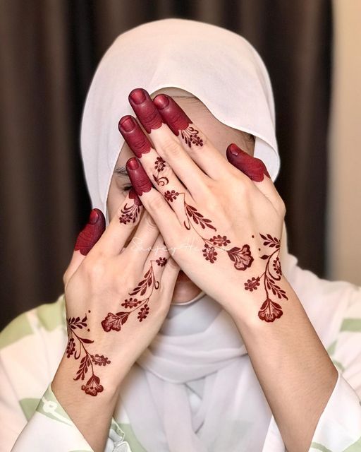 classic red mehndi with flower motifs