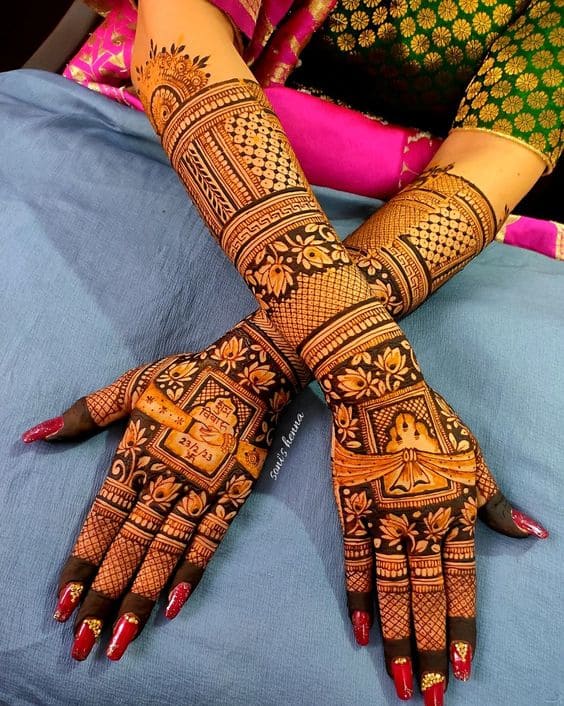 Back hand henna design with wedding motifs