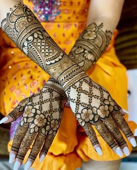 Crisscross mehndi designs with flower motifs