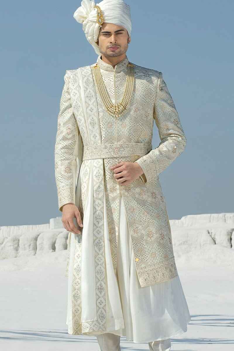 Snow-white-hand-crafted-white-sherwani-for-groom