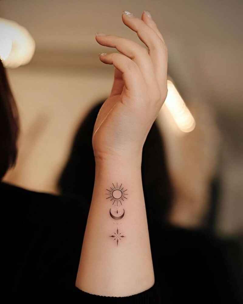 Mini-star-moon-and-sun-tattoo-on-wrist-simple-tattoos-for-girls