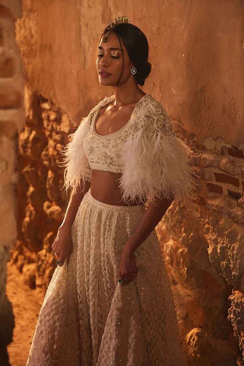 U-shaped-neckline-with-feathers-cape-wedding-blouse-designs