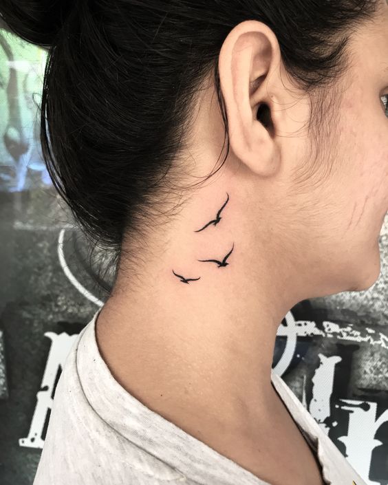 bird neck tattoo
