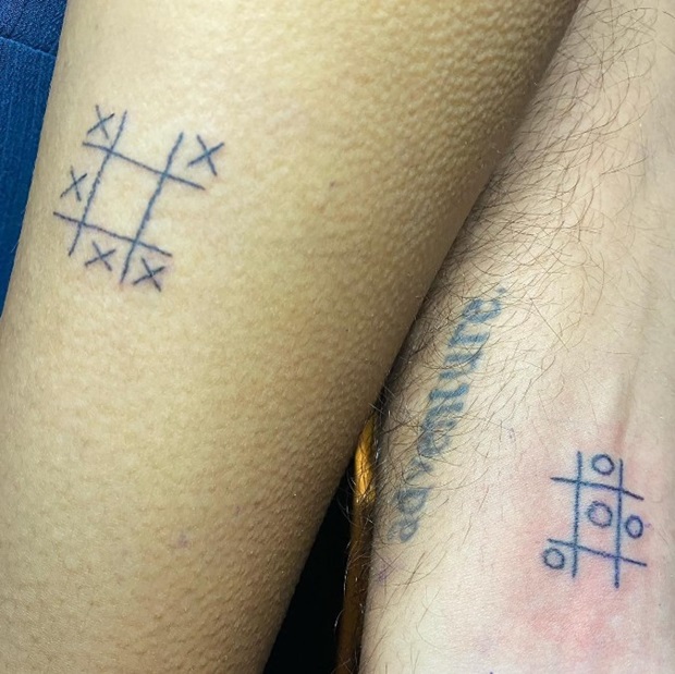 couple tattoo on hand