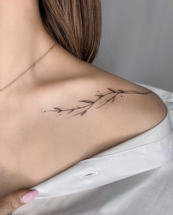 Breezy collar bone tattoo