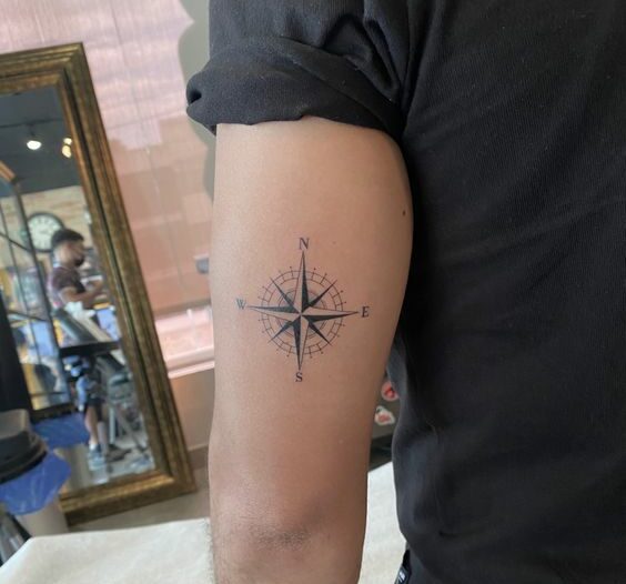 Compass needle tattoo design