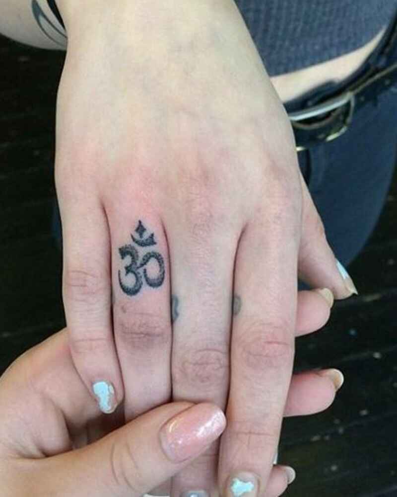 Om-symbol-finger-tattoos-for-girls