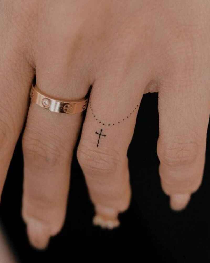Small-cross-finger-tattoos-women