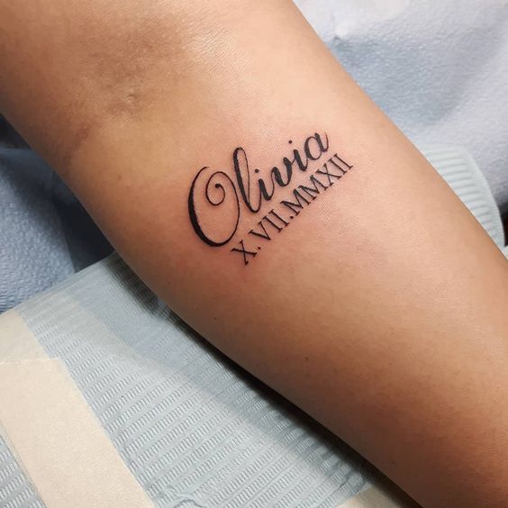 name tattoo with roman numeral